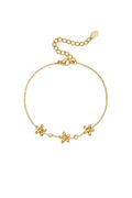 Pulsera con dijes de flores