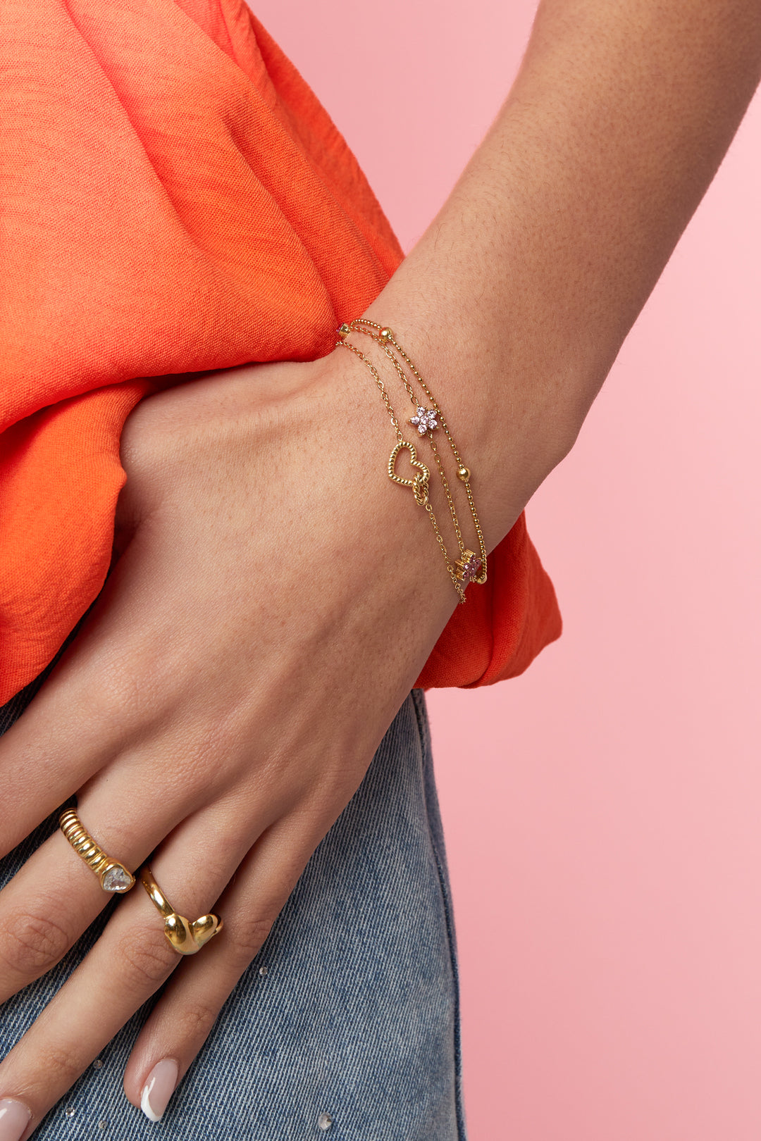 Pulsera con dije de corazón conectado